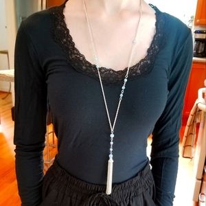 Long silver tassel necklace with blue beads